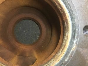 Extensive erosion and crack above suction seat fit