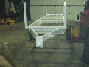 Light weight double ended pipe hauling trailer