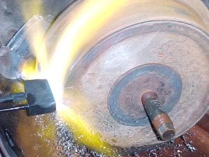 Flame hardening the tread of a mine car wheel